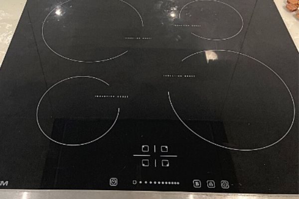 Black induction cooktop repaired by Quality Appliance Repairs Brisbane.