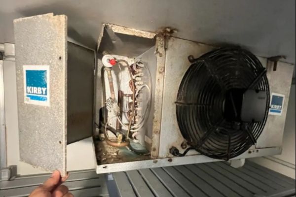 A cool room evaporator unit opened for inspection during repair in Brisbane
