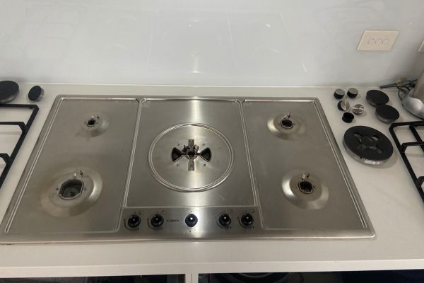 Gas cooktop disassembled for repair in a Brisbane kitchen