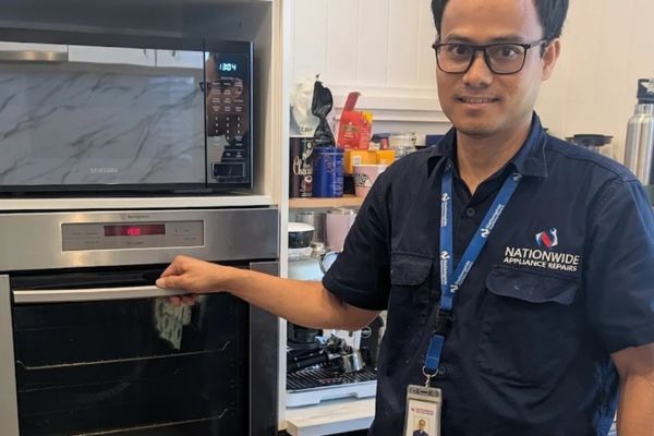 Technician after fixing oven problems in Melbourne