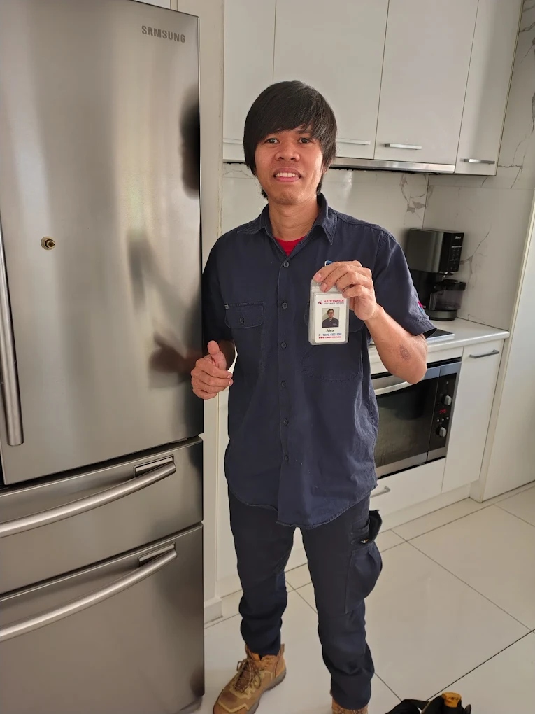 Technician Alex doing fridge repairs in Adelaide