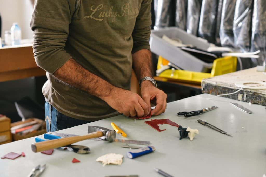 technician sorting his tools to fix a blow oven.