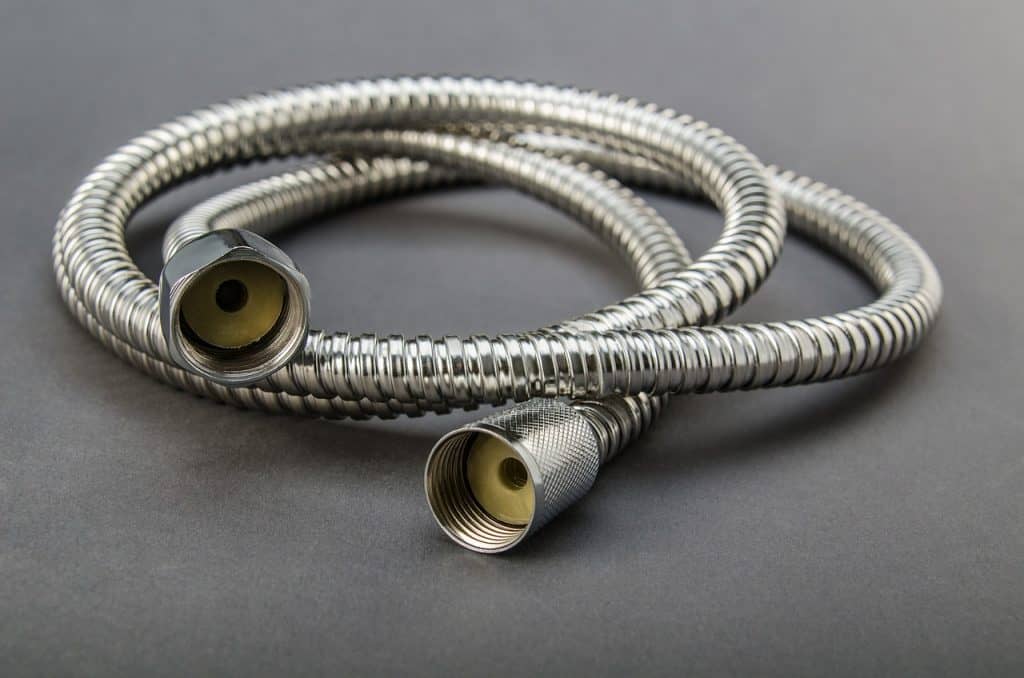 silver hose to disconnect a water supply from a dishwasher