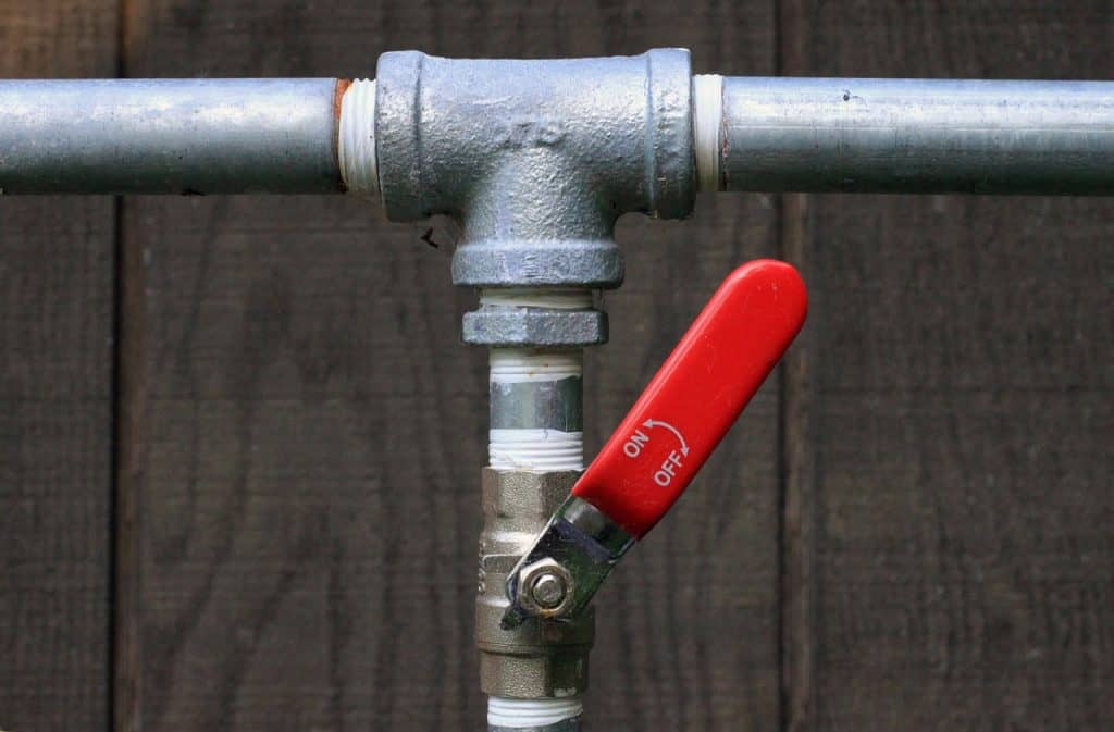 valve with red handle, water pipe, shutting of the water line
