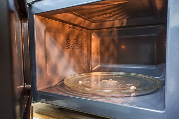 defective microwave oven where the turntable spins but the food stays cold